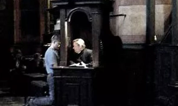 priest talking to church goer